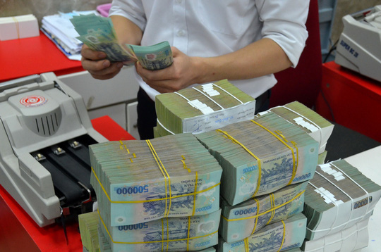 Nhiều chuyên gia cho rằng cần dùng ngân sách nhà nước để xử lý nợ xấu Ảnh: TẤN THẠNH